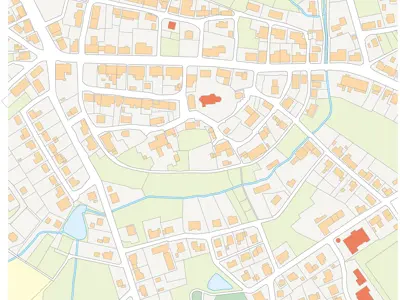 Map showing a section of a city with streets, buildings, and water bodies marked in different colors. 